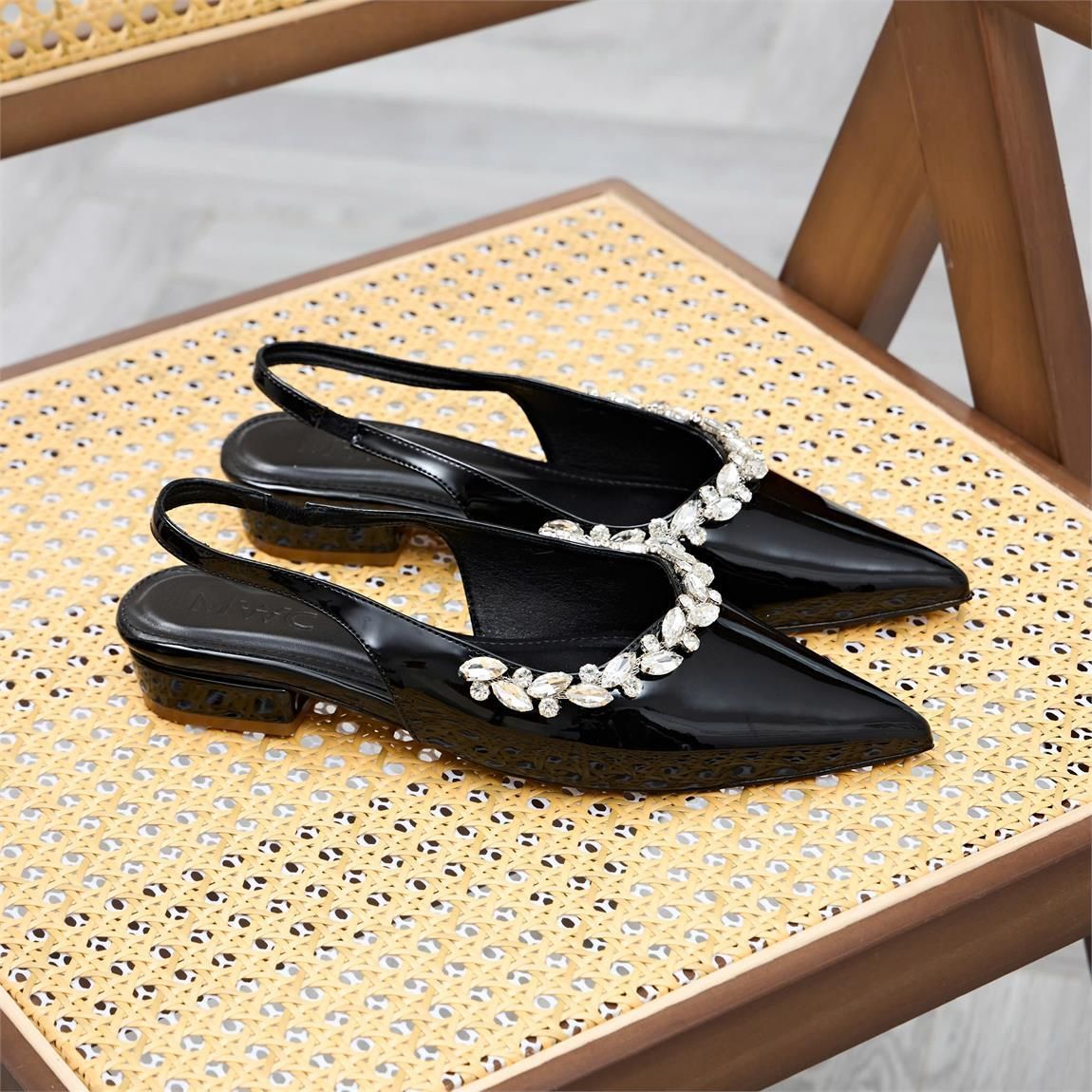 A pair of black shoes on a chairAI-generated content may be incorrect.