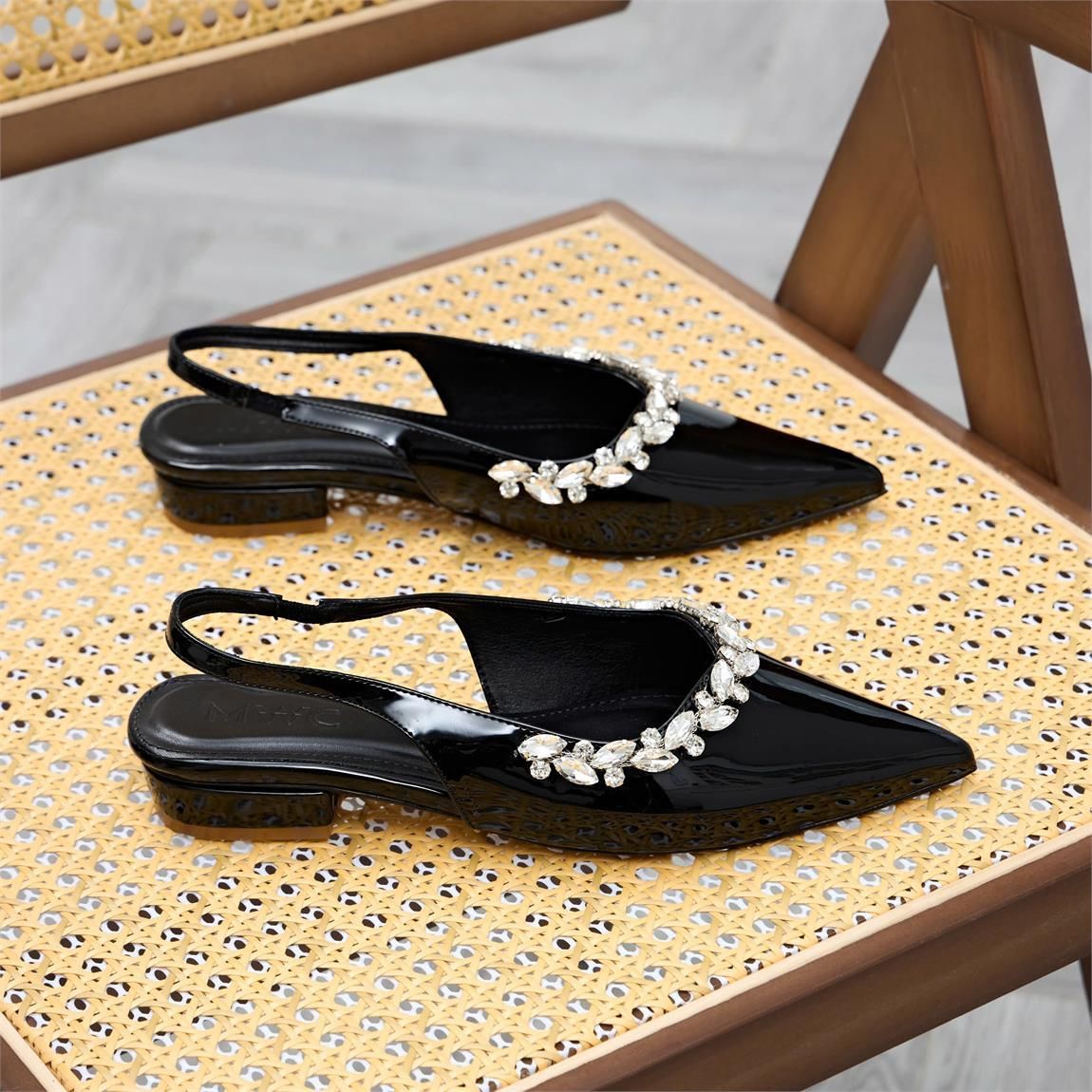 A pair of black shoes on a chairAI-generated content may be incorrect.