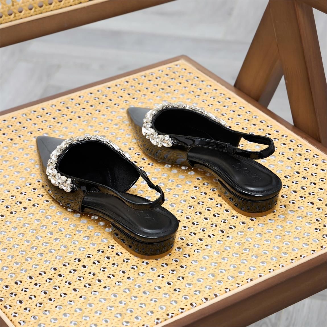 A pair of black shoes on a chairAI-generated content may be incorrect.